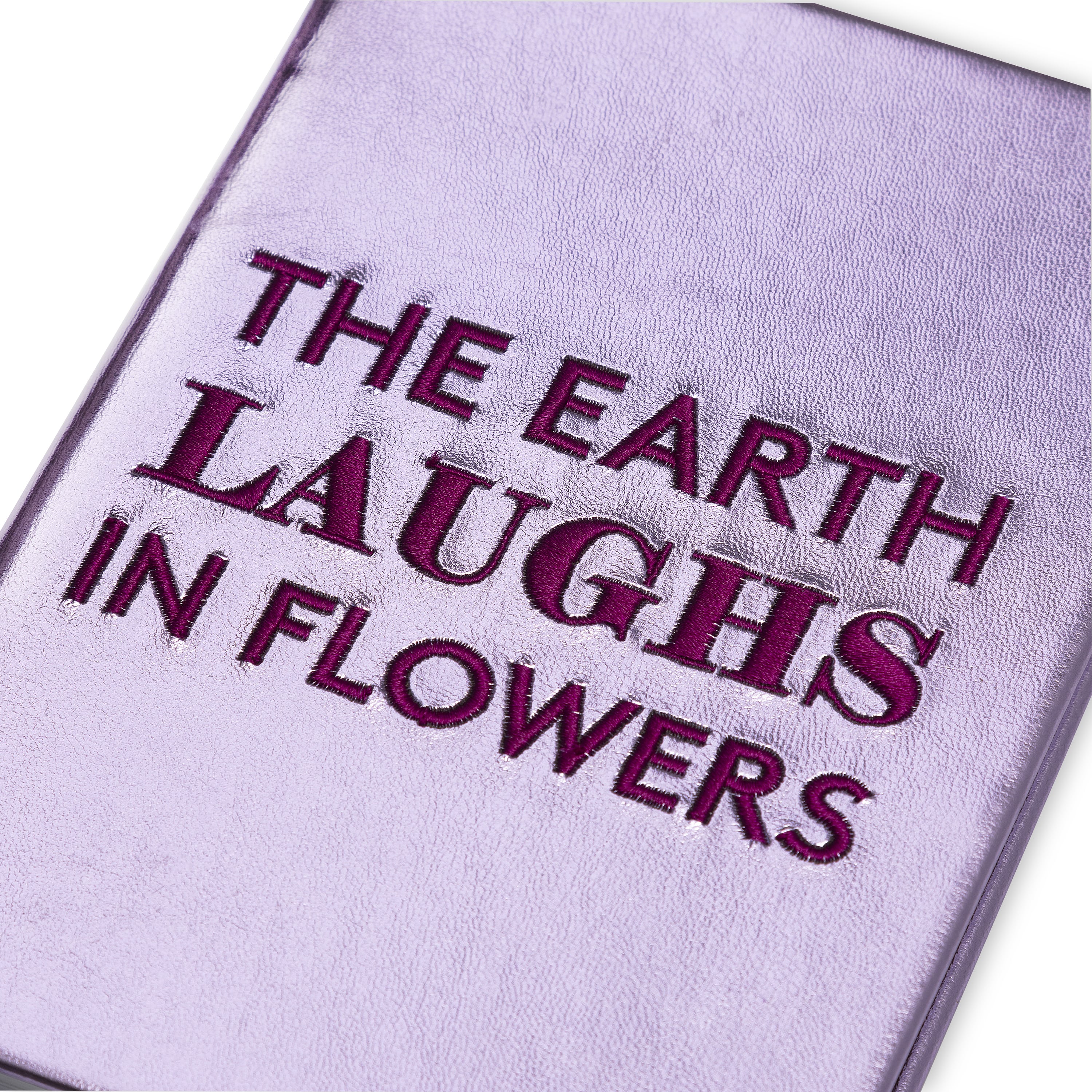 Notebook with embroidery quote - The Earth Laughs in Flowers